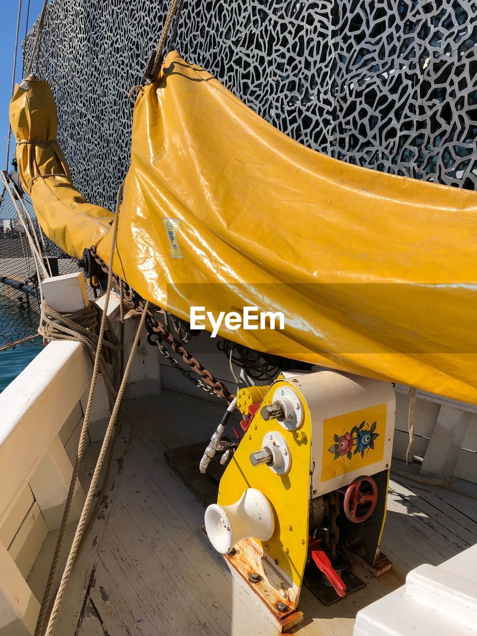 HIGH ANGLE VIEW OF YELLOW SHIP IN CONTAINER