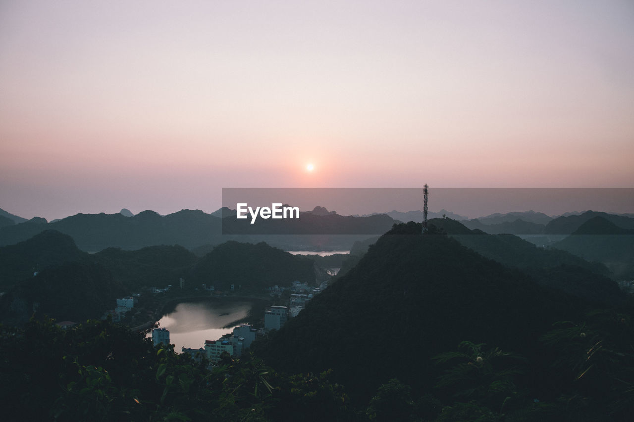 Scenic view of silhouette mountains against sky during sunset