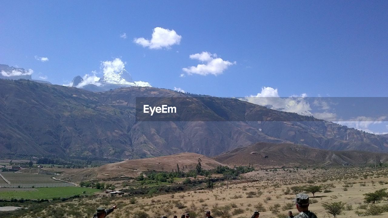 SCENIC VIEW OF MOUNTAINS AGAINST BLUE SKY