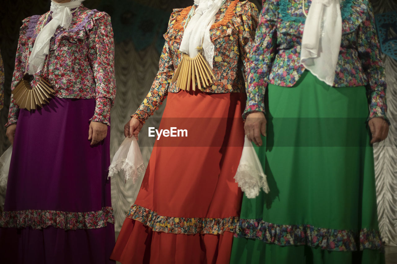 people in traditional clothing dancing in store