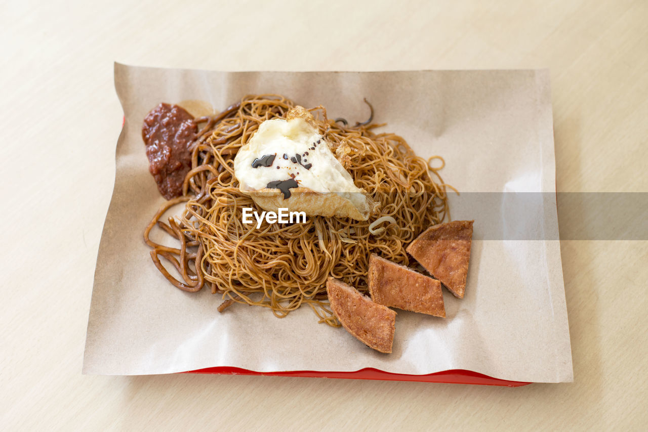 High angle view of noodles in tray on table