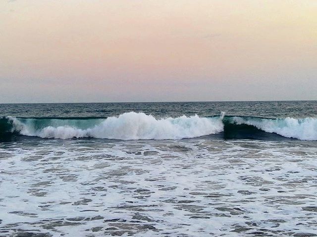 WAVES SPLASHING ON ROCKS