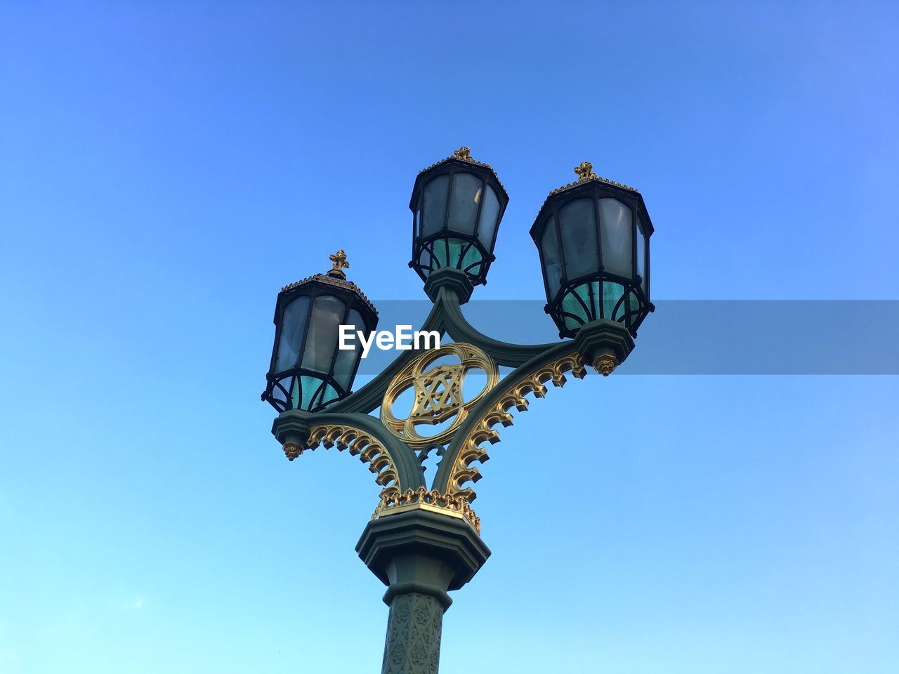 Low angle view of street light against clear sky