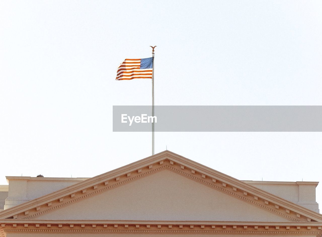 High section of white house building with american flag