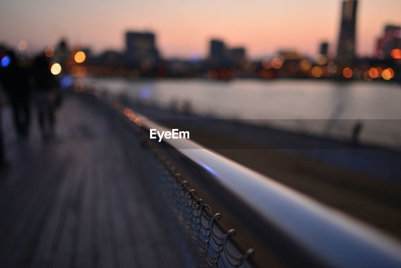 Close-up of fence railing against defocused background