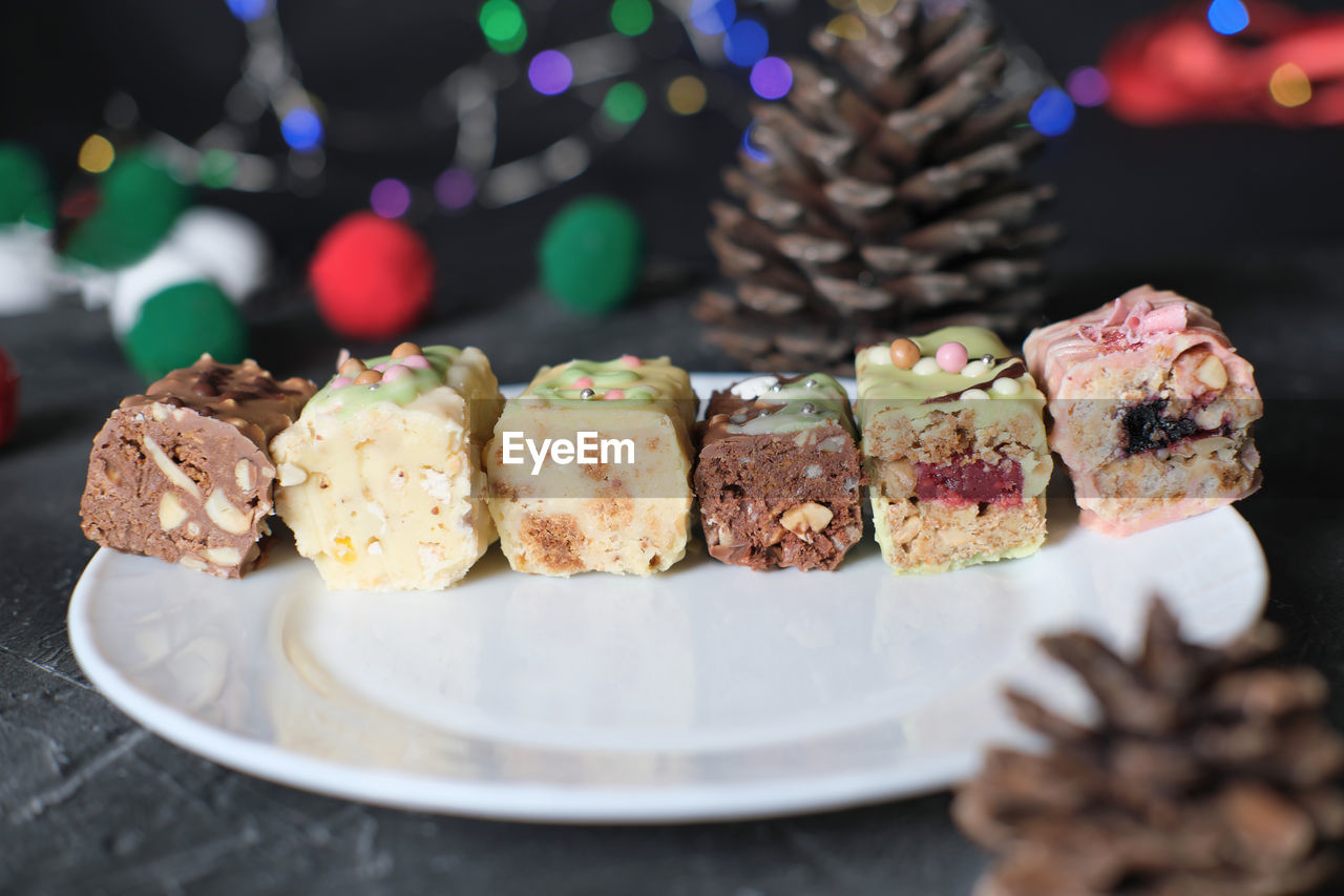 Protein low carb bars with various fillings cut on a plate. new year celebration. keto and paleo