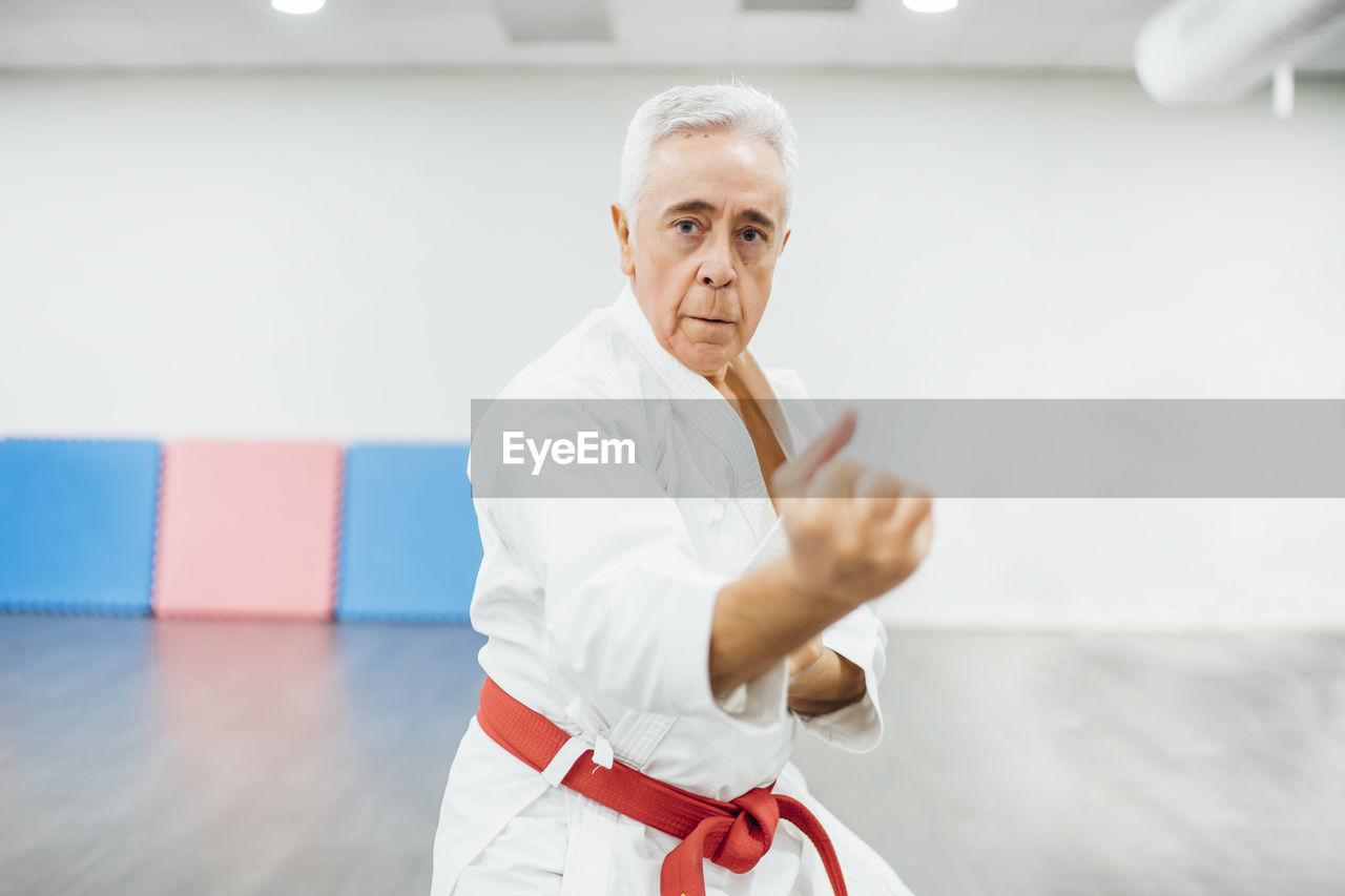 Senior karate master performing combat techniques