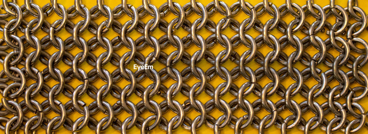 FULL FRAME SHOT OF PATTERNED METAL FENCE