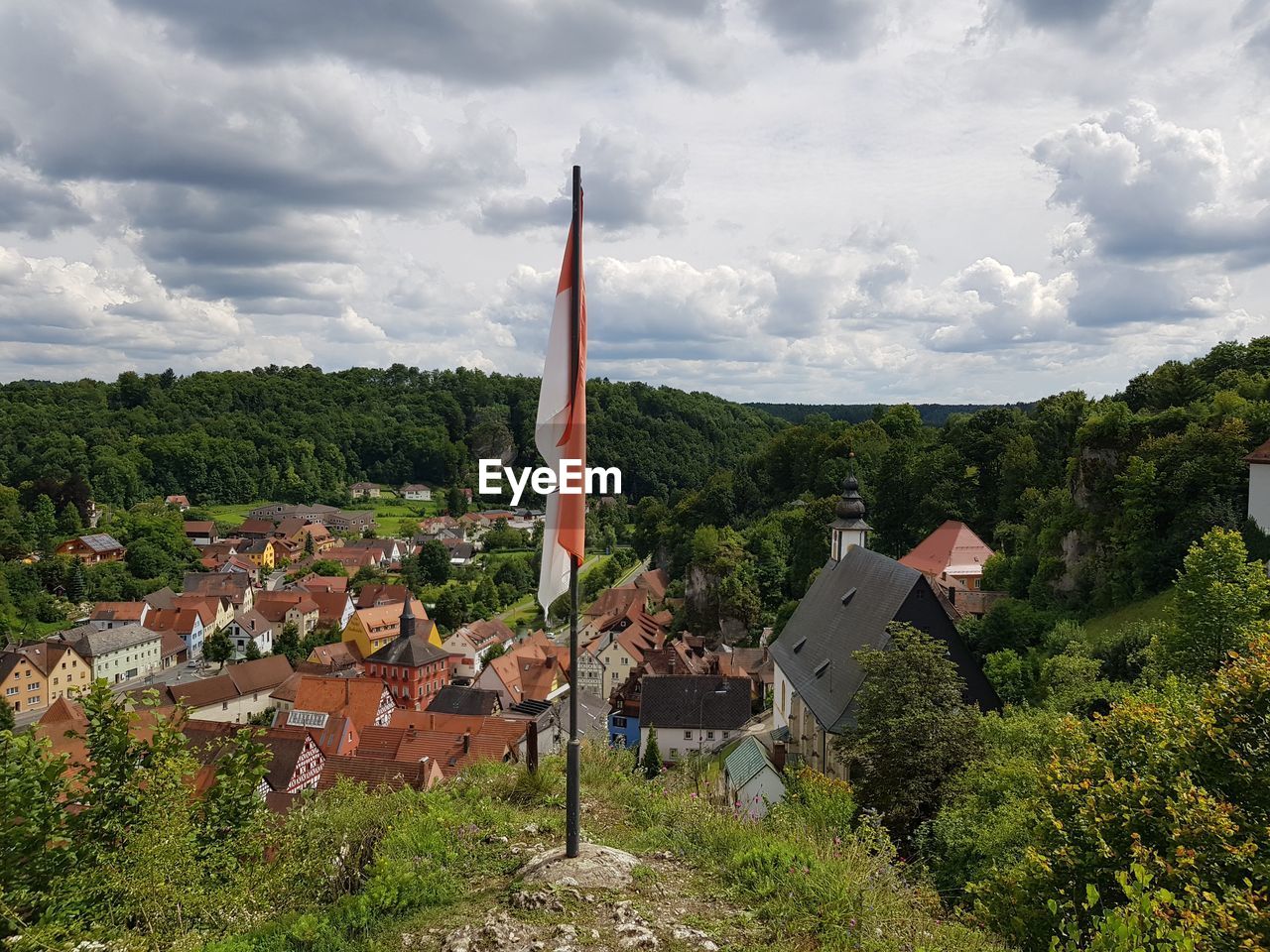 Houses on landscape against sky