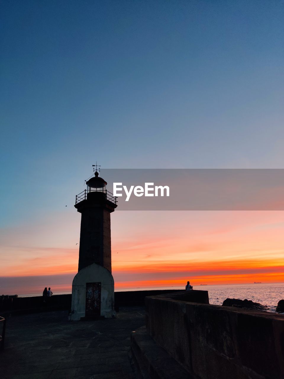 LIGHTHOUSE AGAINST SKY DURING SUNSET