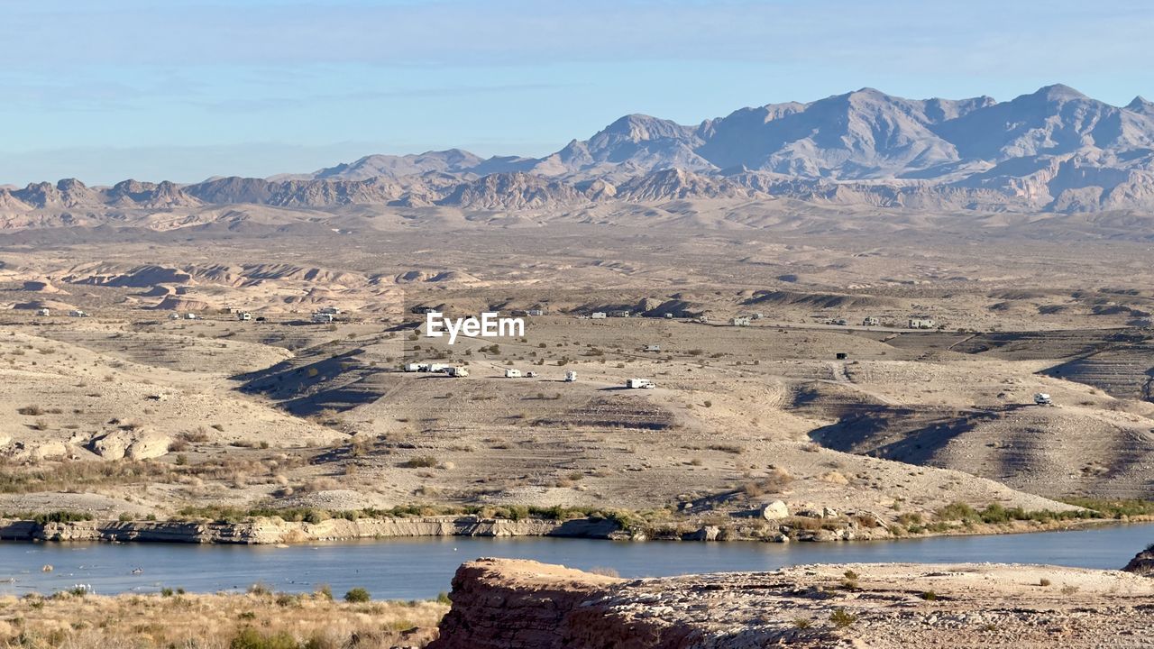 scenic view of landscape and mountains against sky