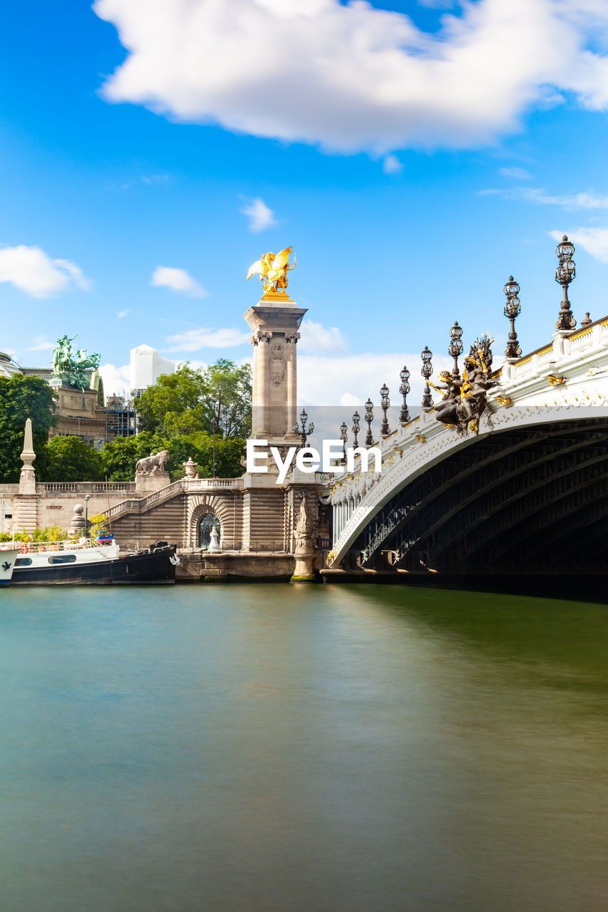 VIEW OF BRIDGE OVER RIVER AGAINST SKY