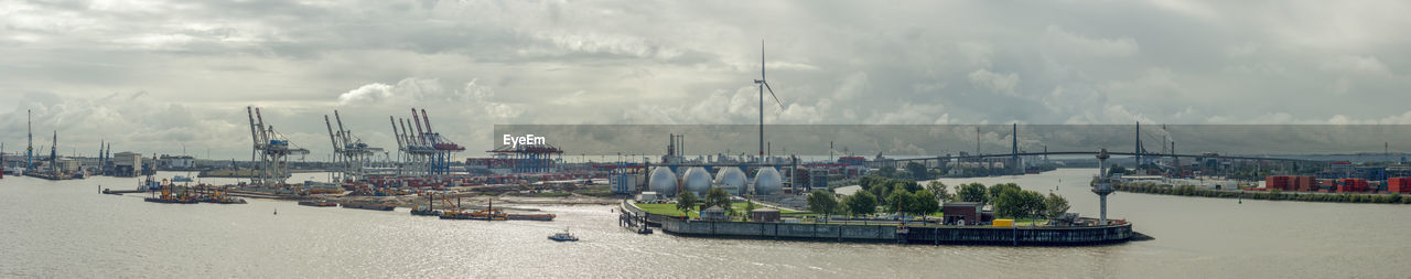 Panoramic view of sailboats in sea against sky