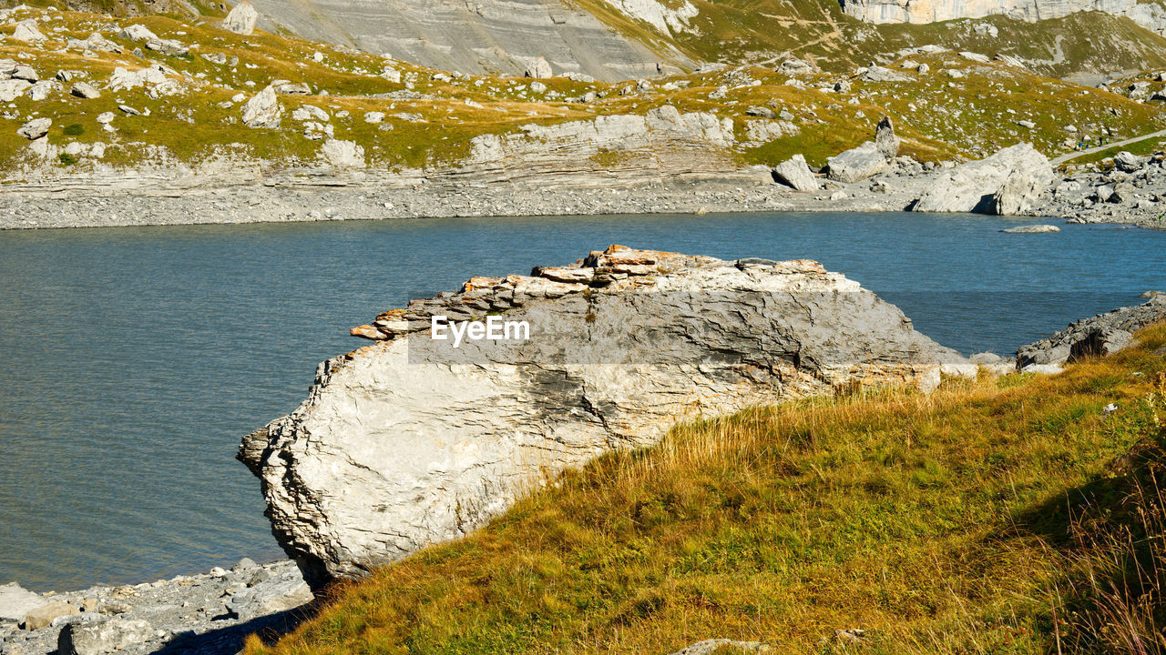 Scenic view of rocks by sea