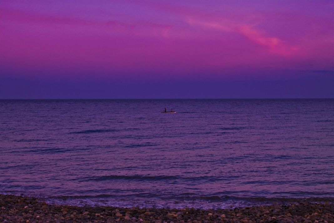 SCENIC VIEW OF SUNSET OVER SEA