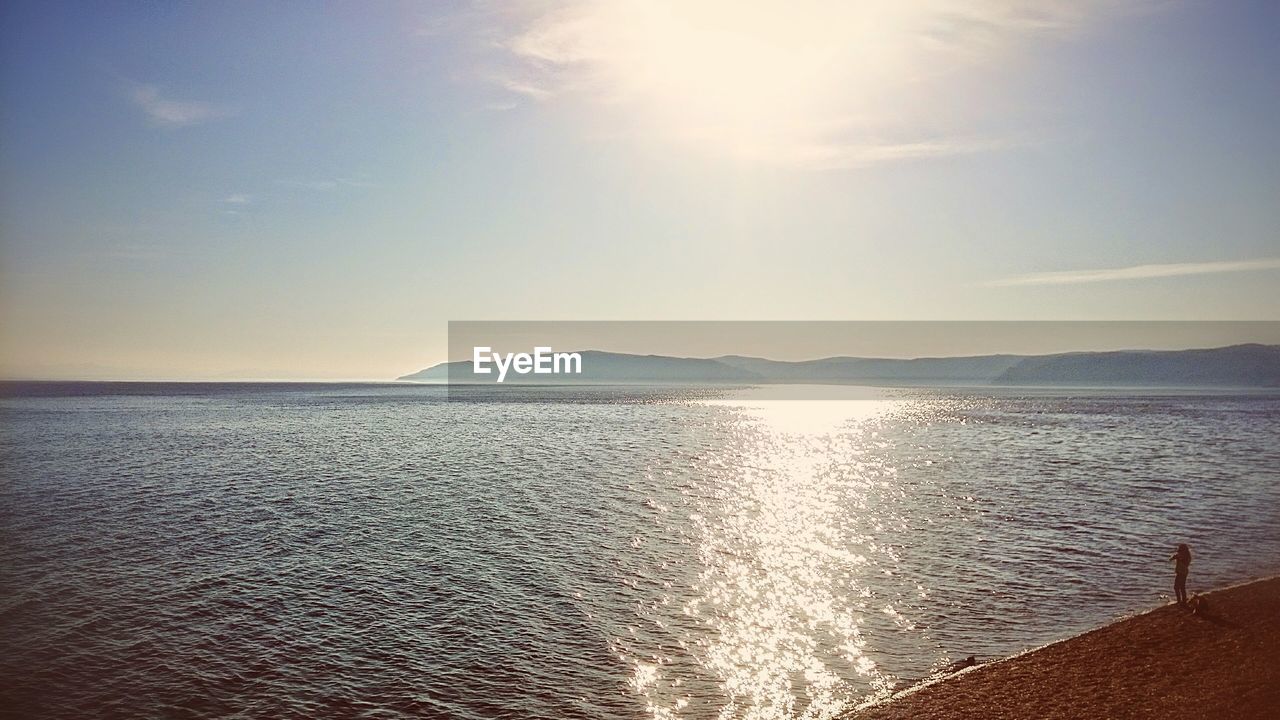Shiny sea under blue sky