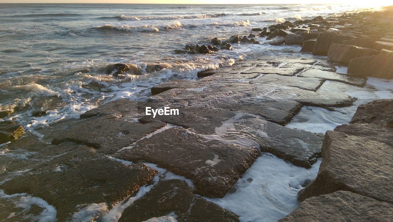 Close-up of waters edge at beach