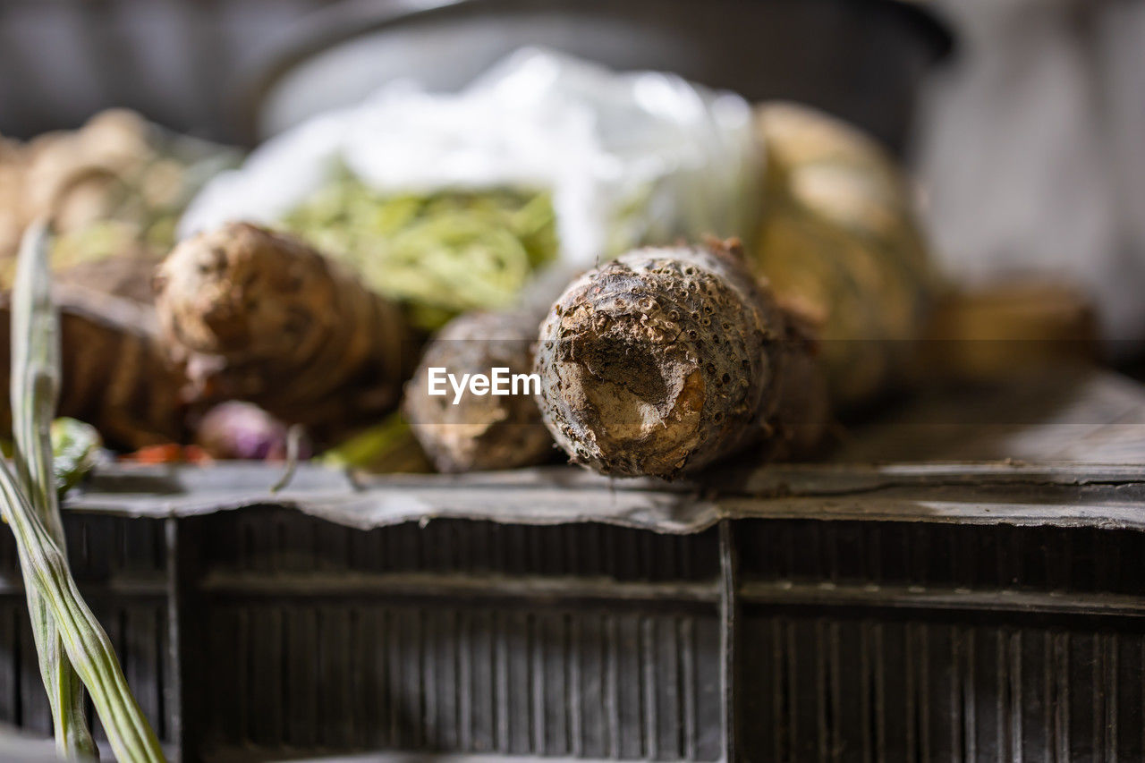 Fresh yam vegetable at vegetable store fro sale with shallow depth of field and blurred background