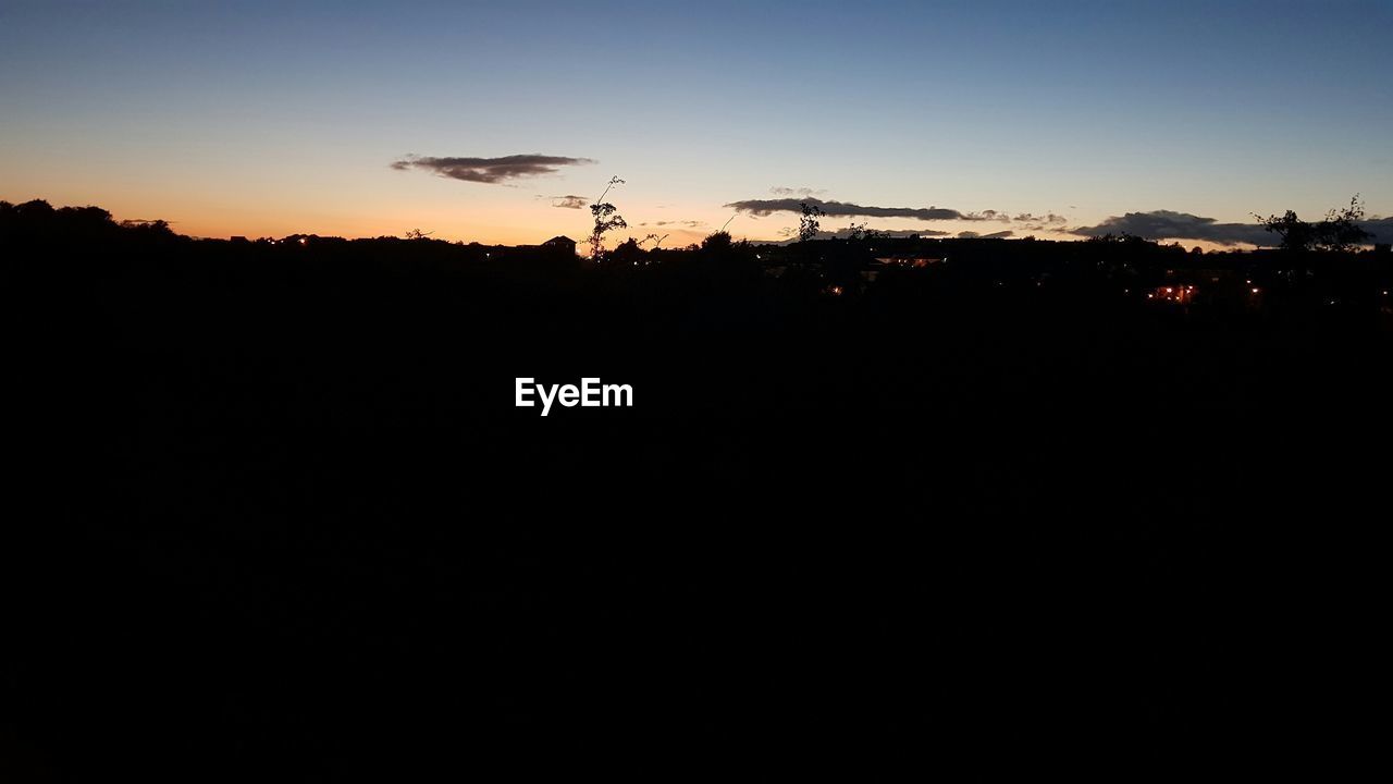 SILHOUETTE LANDSCAPE AGAINST SKY DURING SUNSET