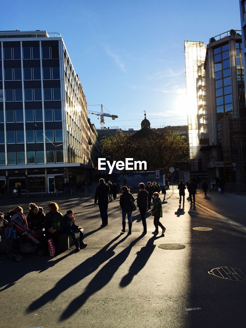 PEOPLE WALKING ON CITY STREET