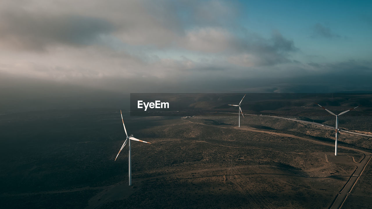 renewable energy, alternative energy, wind turbine, environmental conservation, environment, turbine, wind power, windmill, power generation, sky, wind farm, cloud, nature, beauty in nature, landscape, wind, electricity, sustainable resources, technology, power in nature, power supply, no people, environmental issues, scenics - nature, social issues, outdoors, rural scene, tranquility, horizon, land, field, tranquil scene, day, non-urban scene, agriculture, mountain, farm, sunlight