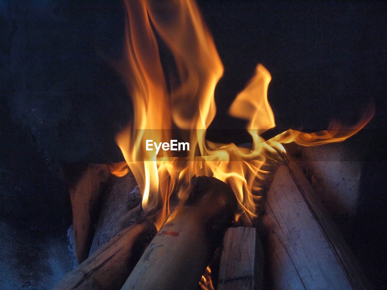 High angle view of fire burning at night