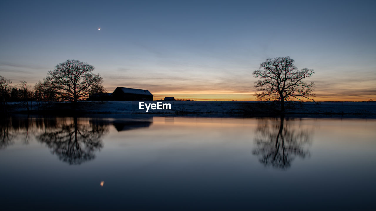 Sunset reflecting in the water surface of the lake