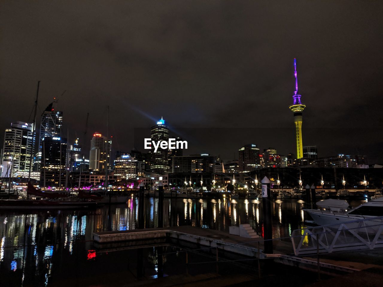 ILLUMINATED CITY BUILDINGS AT NIGHT