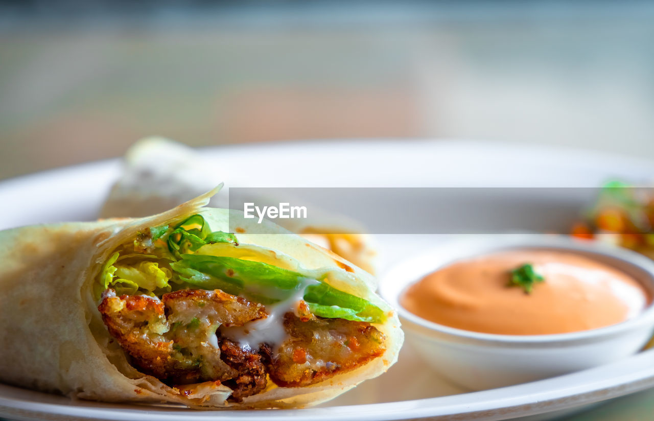 CLOSE-UP OF FOOD ON TABLE