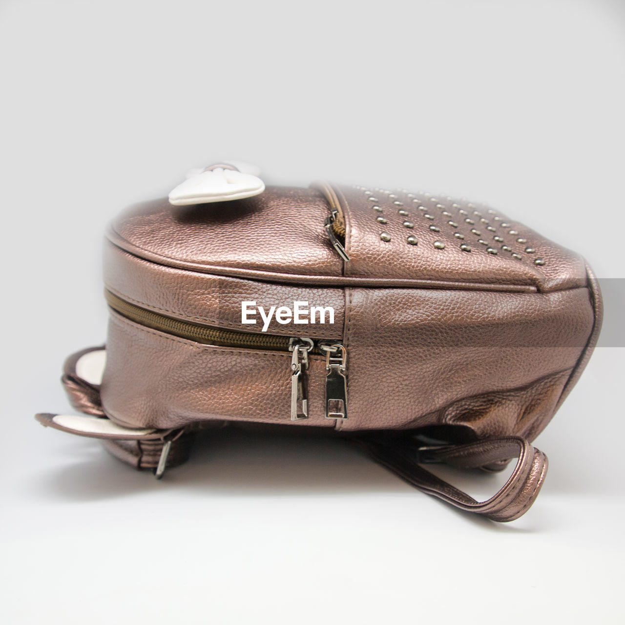 CLOSE-UP OF ELECTRIC LIGHT AGAINST WHITE BACKGROUND