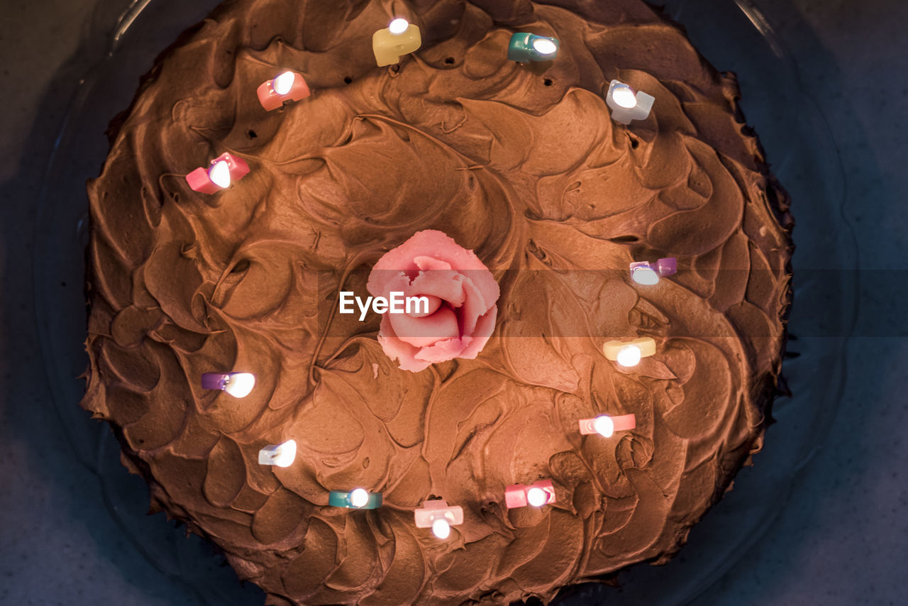 HIGH ANGLE VIEW OF ILLUMINATED LIGHTING ON TABLE