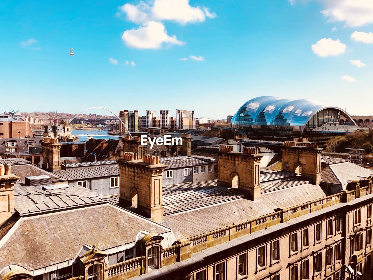 BUILDINGS AGAINST BLUE SKY