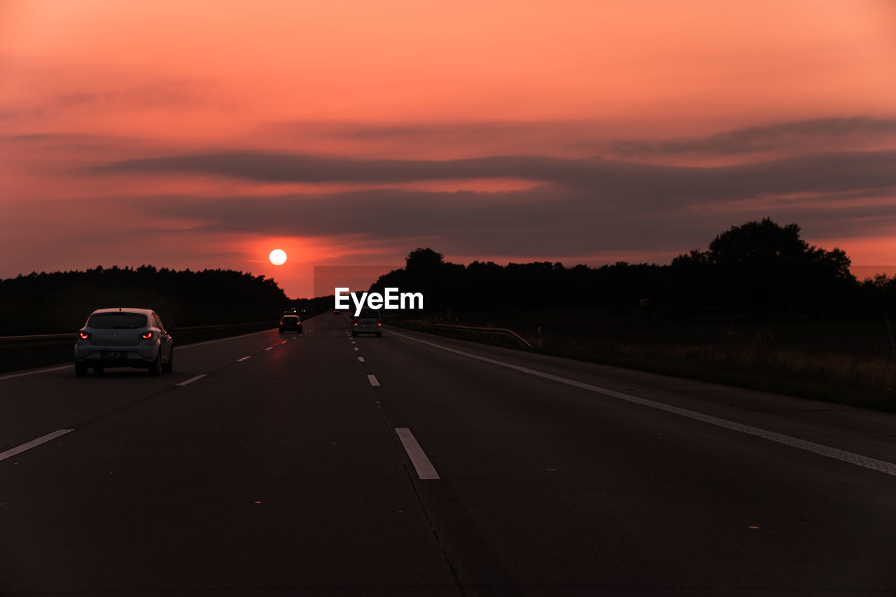 VIEW OF ROAD AT SUNSET