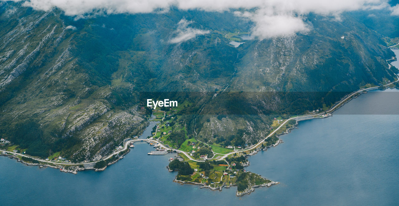 Aerial view of mountain by sea