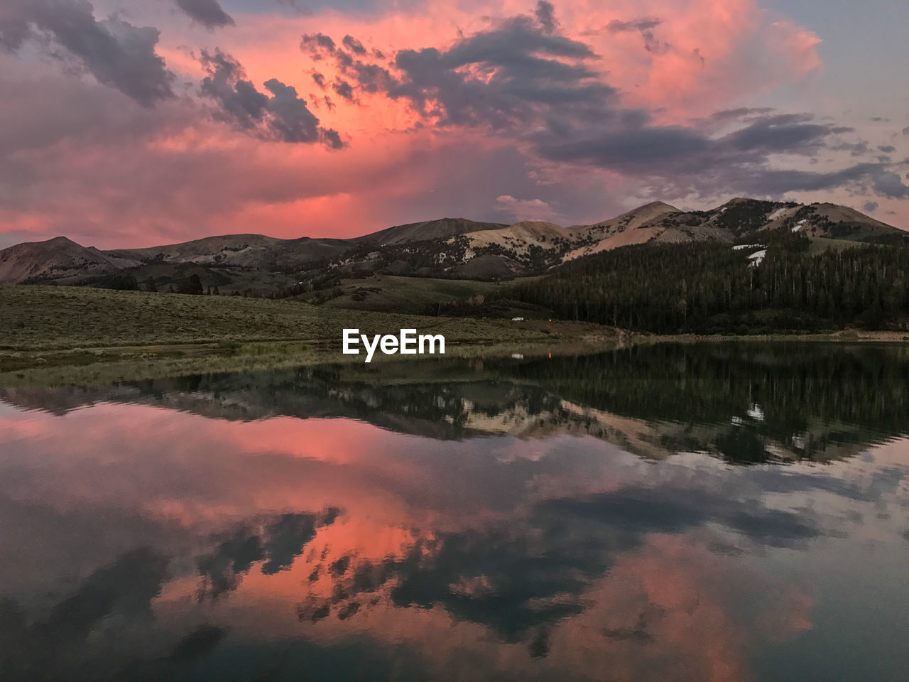 Scenic view of lake against sky during sunset