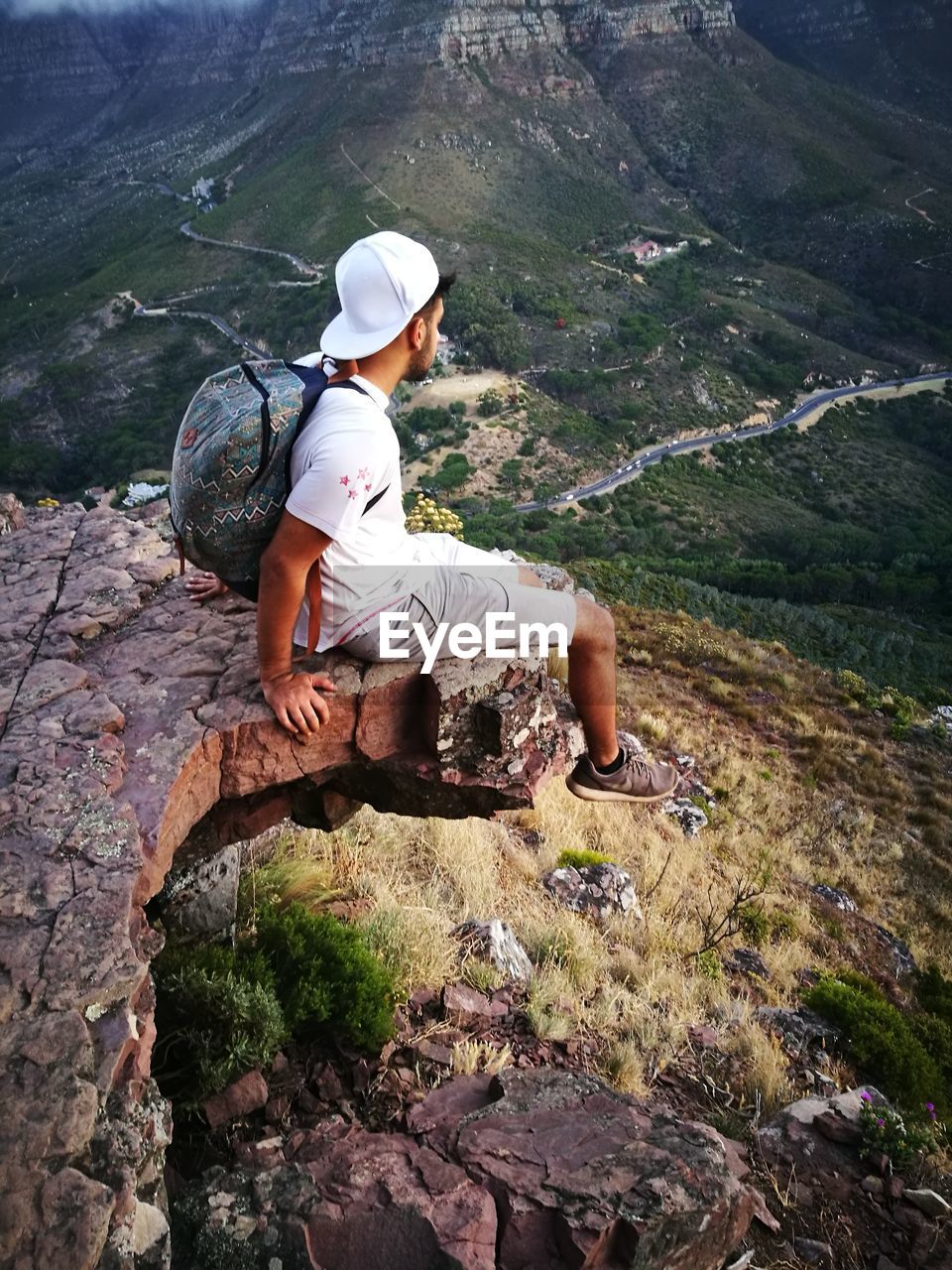 Hiker resting on top of mountain at lions head