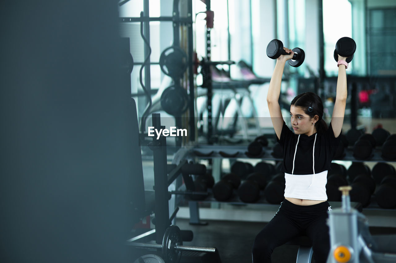 Girl exercising in gym