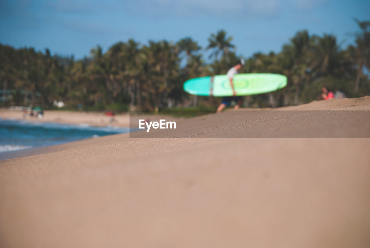 Surface level of beach against sky