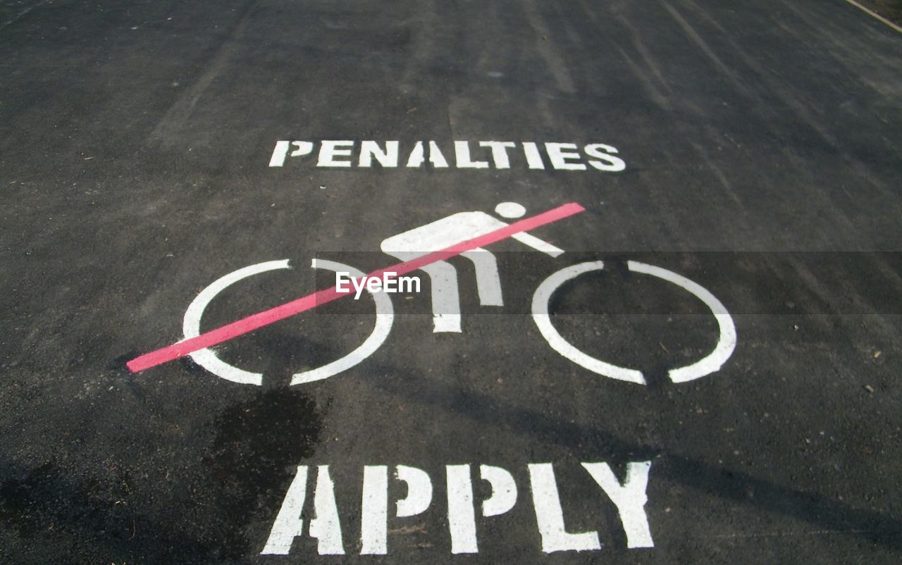 High angle view of warning sign on road