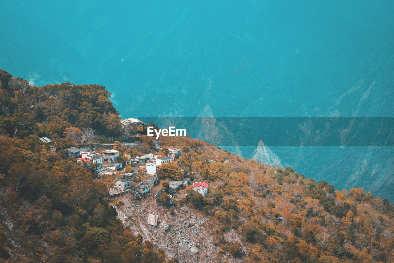 High angle view of buildings by sea