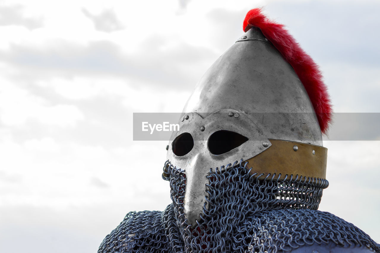 Close-up of armor costume against sky