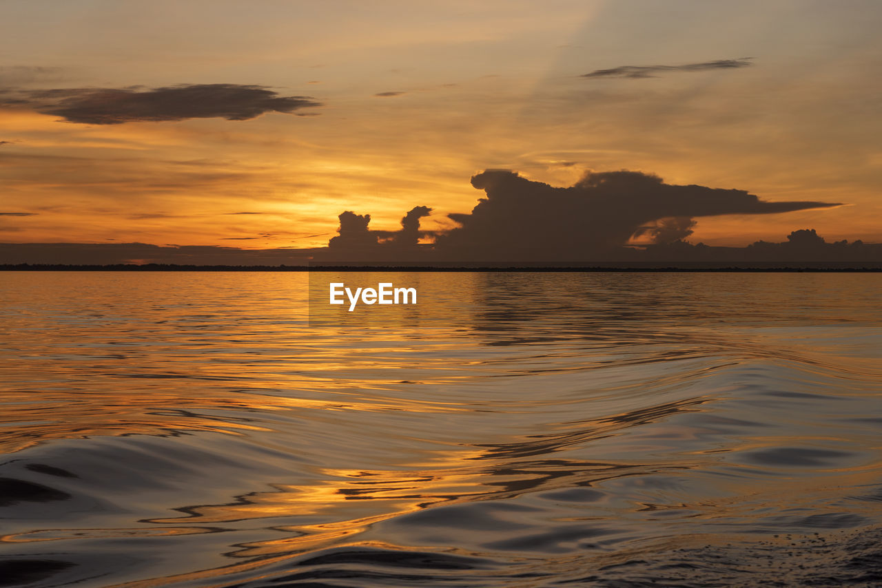 Beautiful colorful amazon sunset over the waters of negro river