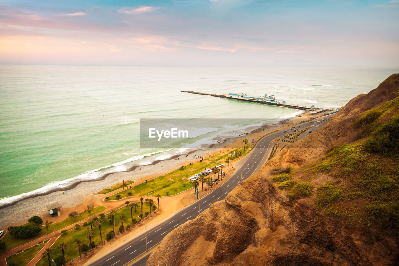 High angle view of beach against sky during sunset