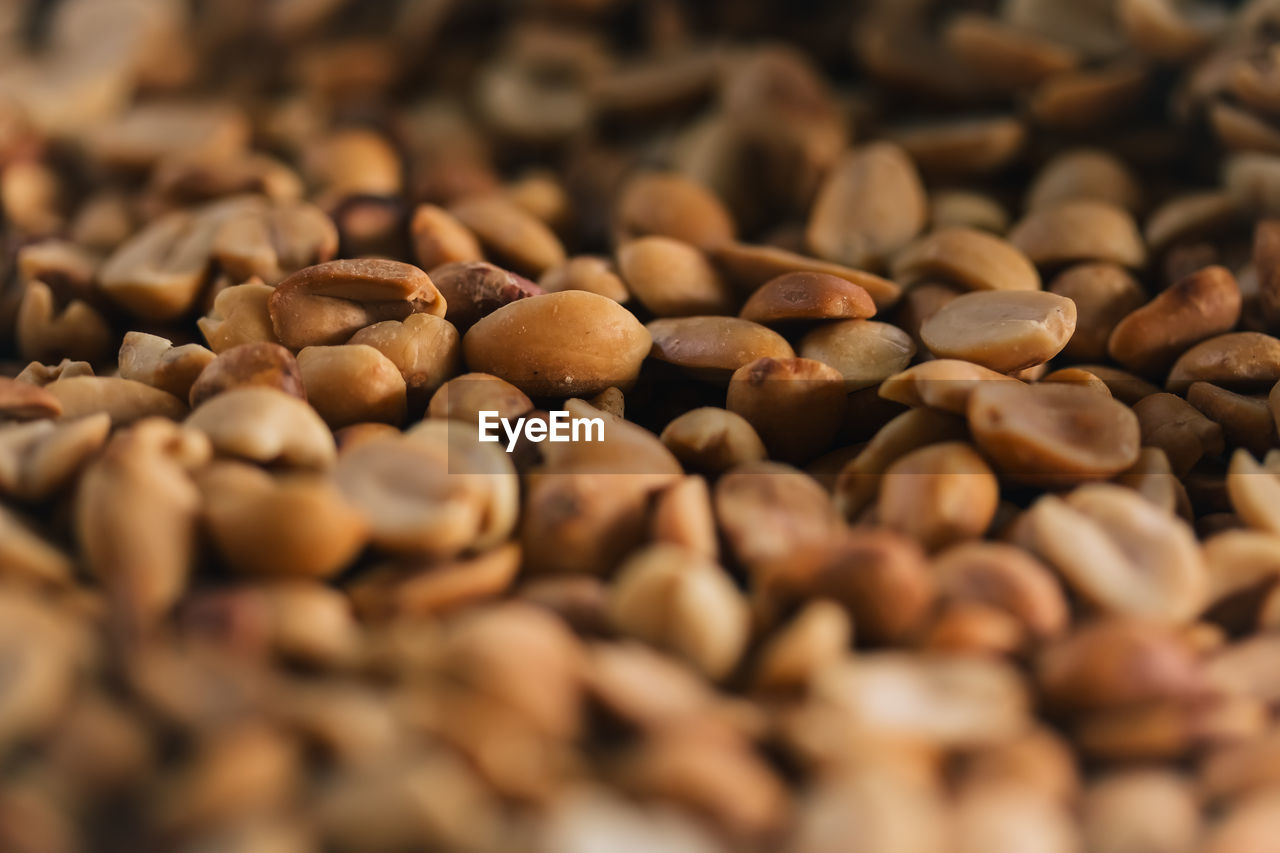 FULL FRAME SHOT OF COFFEE BEANS IN FOREGROUND