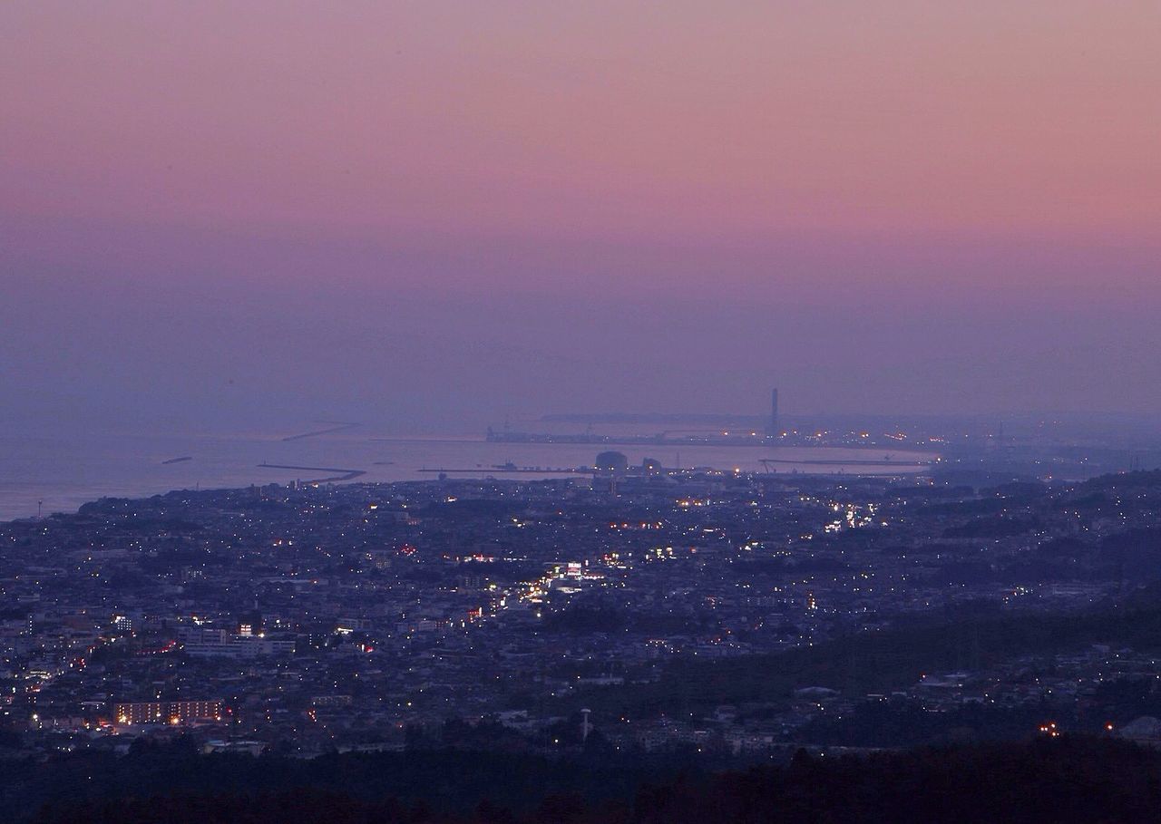 ILLUMINATED CITYSCAPE AT NIGHT