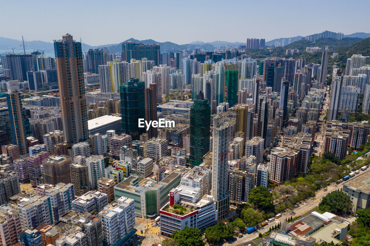 AERIAL VIEW OF CITY BUILDINGS AGAINST SKY