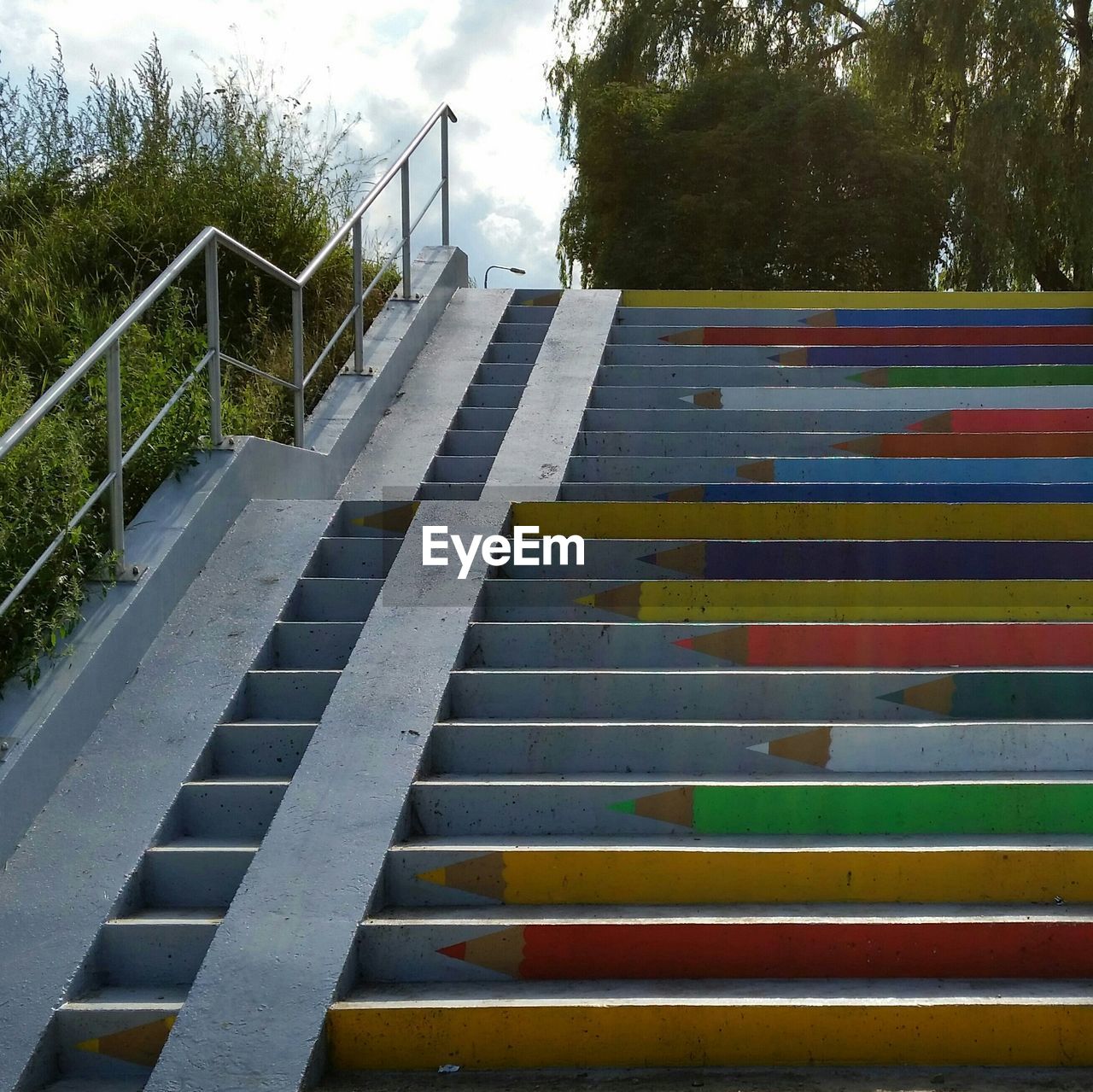 Outdoor stairway with drawings of colored pencils