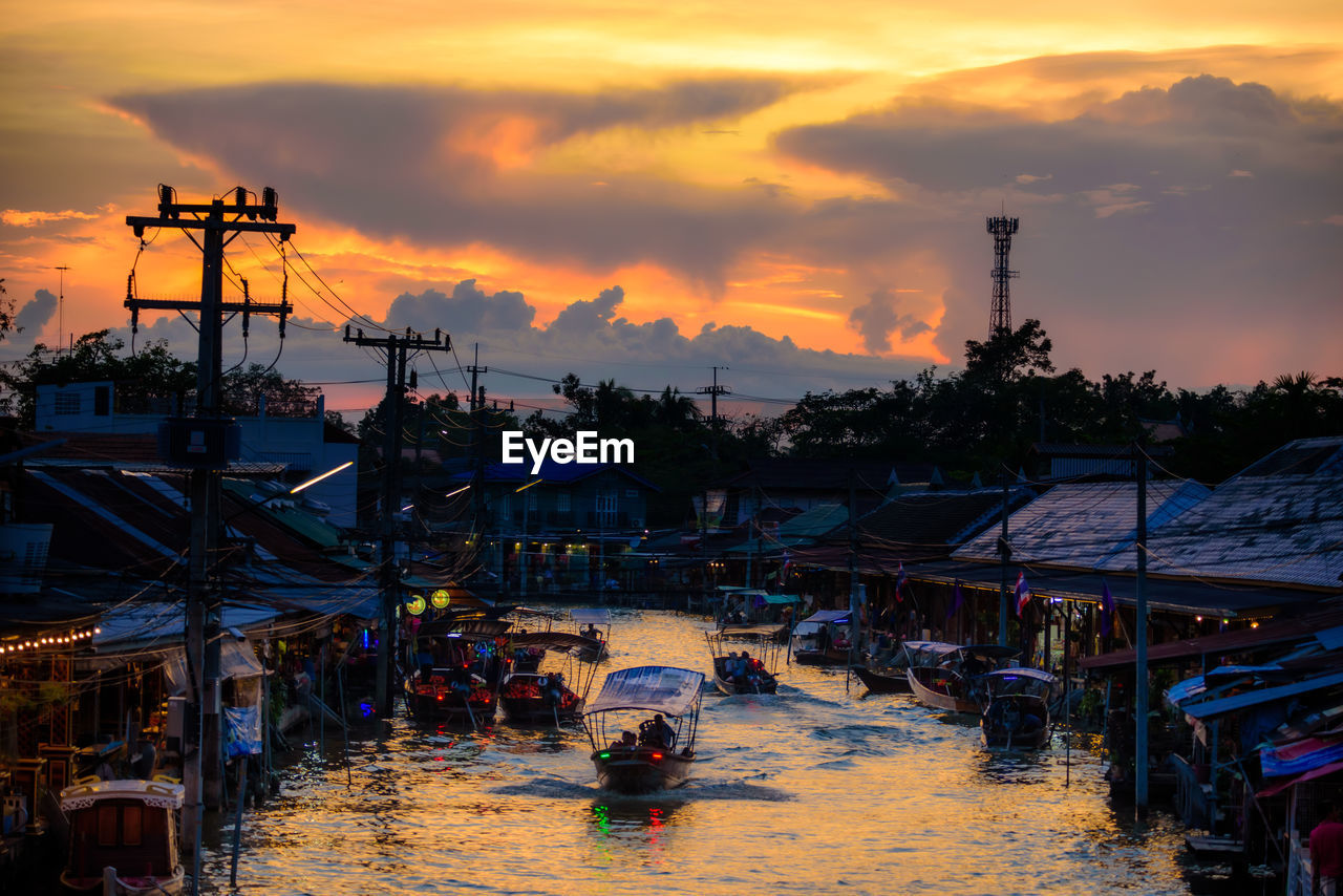 Tourist boats take tourists to see fireflies. at amphawa floating market, thailand