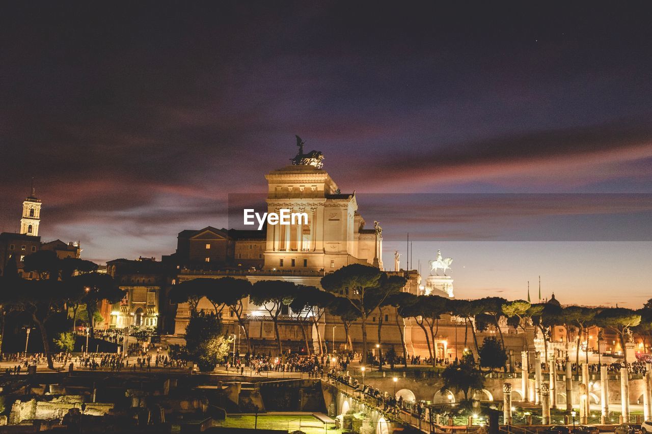 Illuminated buildings in city at night