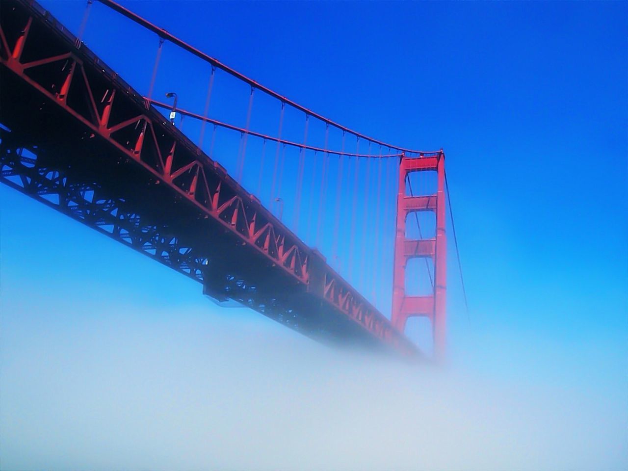 LOW ANGLE VIEW OF SUSPENSION BRIDGE AGAINST CLEAR SKY